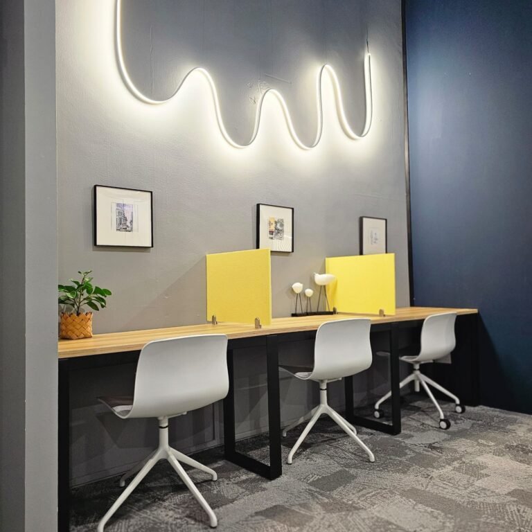 Hot desk row with neon lighting at Dott Co+work Woodlands