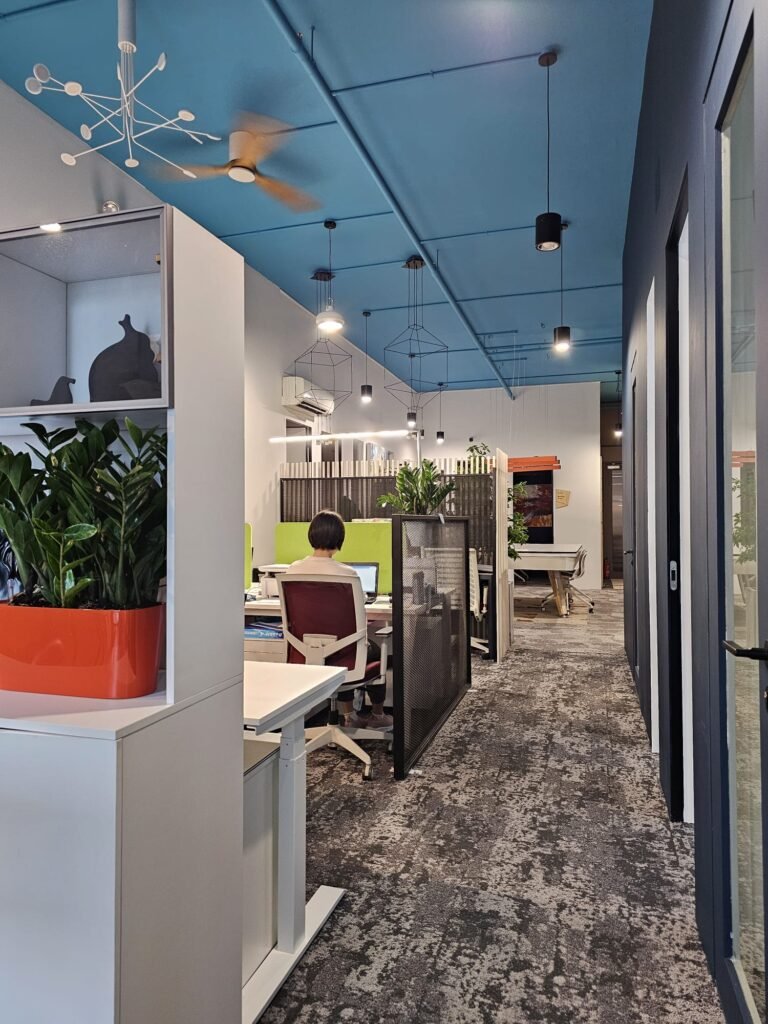 Dedicated desks with storage shelves at Dott Co+work Woodlands
